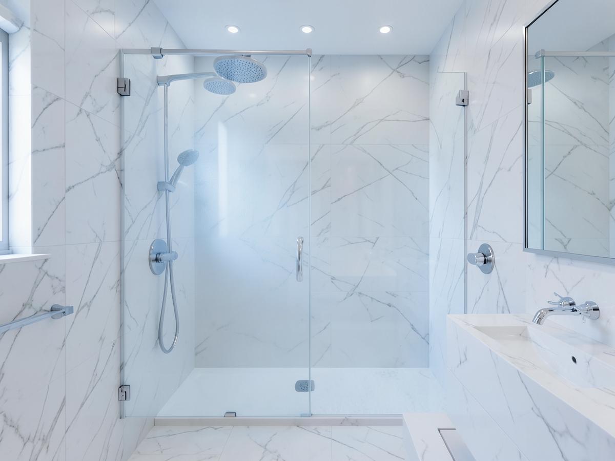 Streak-free glass shower and polished marble bathroom